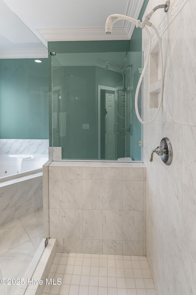 bathroom with ornamental molding, a shower stall, and a garden tub