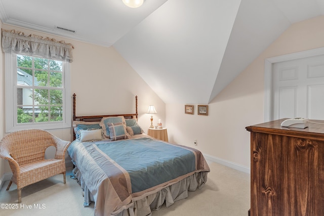 bedroom with light carpet, lofted ceiling, and baseboards