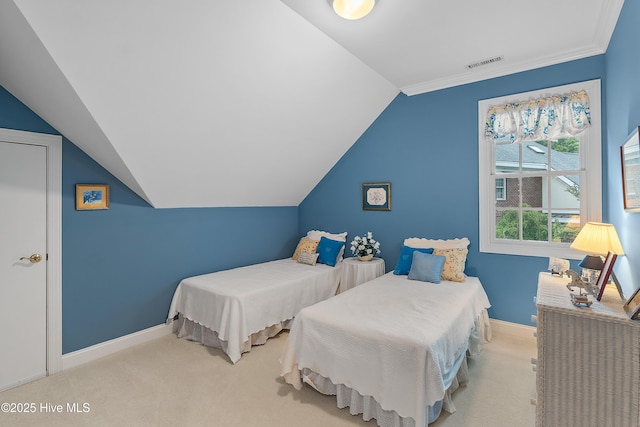 bedroom featuring carpet floors, baseboards, vaulted ceiling, and crown molding