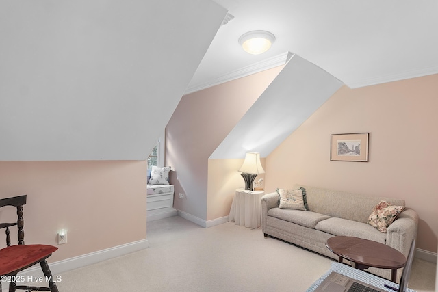carpeted living room with vaulted ceiling, baseboards, and ornamental molding