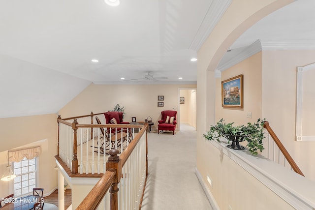hall with recessed lighting, arched walkways, light colored carpet, ornamental molding, and vaulted ceiling