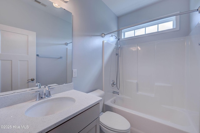 full bath with toilet, vanity, and  shower combination