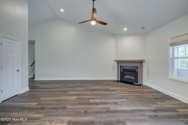 unfurnished living room with a ceiling fan, a fireplace with flush hearth, wood finished floors, recessed lighting, and baseboards