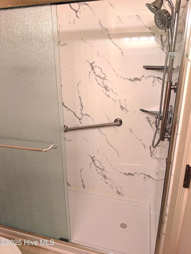 bathroom with a stall shower