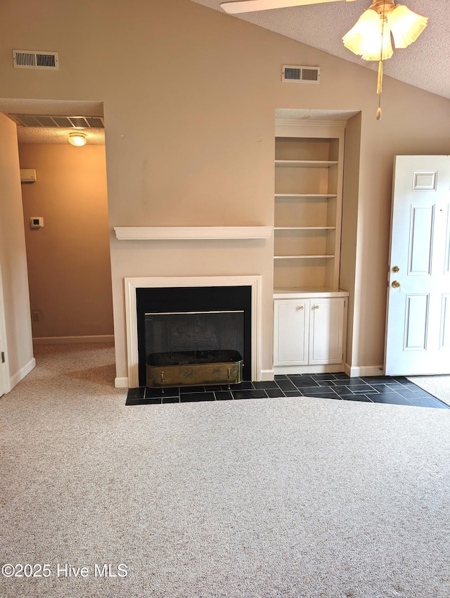unfurnished living room with a fireplace with flush hearth, vaulted ceiling, a ceiling fan, carpet flooring, and baseboards