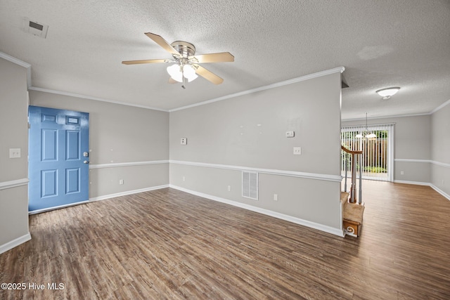 unfurnished room featuring wood finished floors, ceiling fan, crown molding, a textured ceiling, and a chandelier