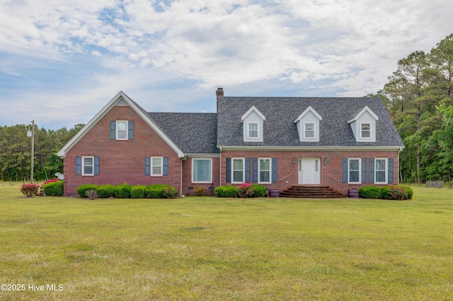 15554 US Highway 421, Burgaw, NC 28425 - cape cod home with brick siding, a chimney, a front yard, and roof with shingles