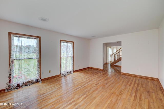 15554 US Highway 421, Burgaw, NC 28425 - unfurnished room featuring light wood finished floors, baseboards, and stairway