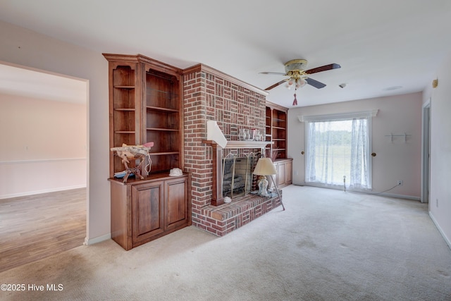 15554 US Highway 421, Burgaw, NC 28425 - unfurnished living room featuring ceiling fan, light colored carpet, a fireplace, and baseboards