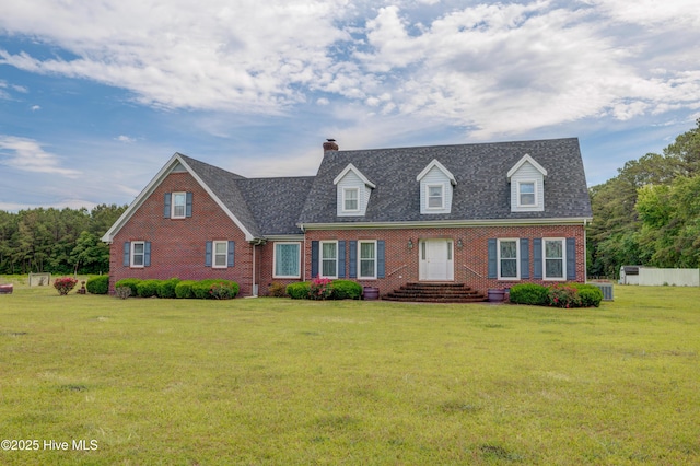 15554 US Highway 421, Burgaw, NC 28425 - cape cod-style house with brick siding, a chimney, and a front lawn