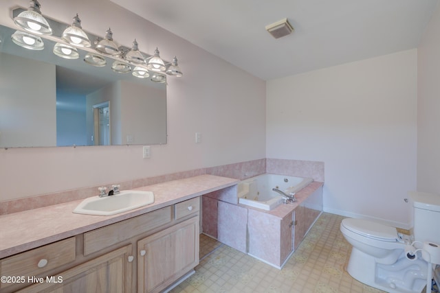 15554 US Highway 421, Burgaw, NC 28425 - bathroom featuring toilet, a tub with jets, and vanity