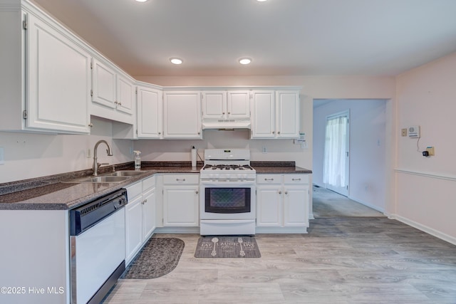 15554 US Highway 421, Burgaw, NC 28425 - kitchen with white appliances, a sink, under cabinet range hood, dark countertops, and recessed lighting