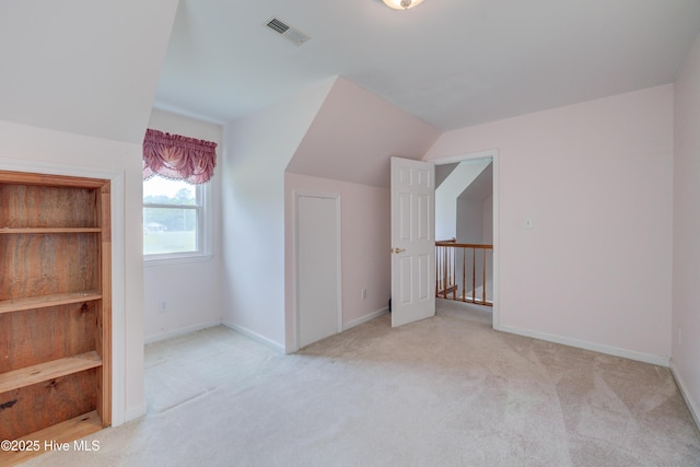 15554 US Highway 421, Burgaw, NC 28425 - additional living space featuring light colored carpet, baseboards, and lofted ceiling