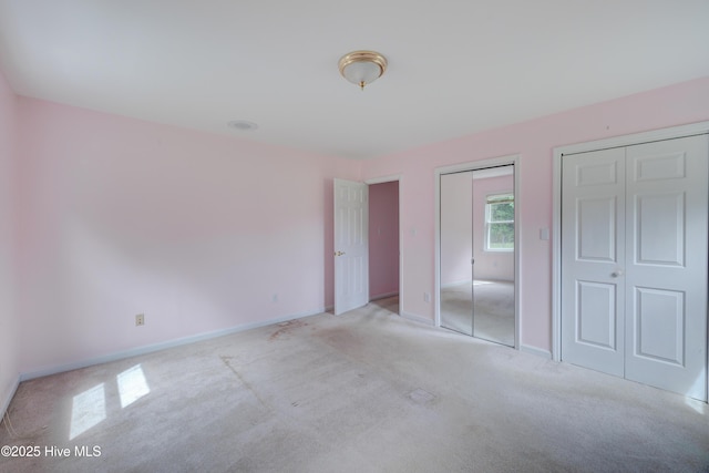 15554 US Highway 421, Burgaw, NC 28425 - unfurnished bedroom with multiple closets, light carpet, and baseboards
