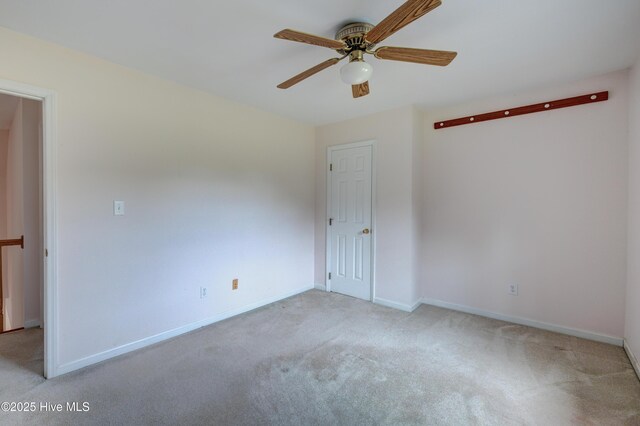15554 US Highway 421, Burgaw, NC 28425 - empty room featuring light carpet, ceiling fan, and baseboards