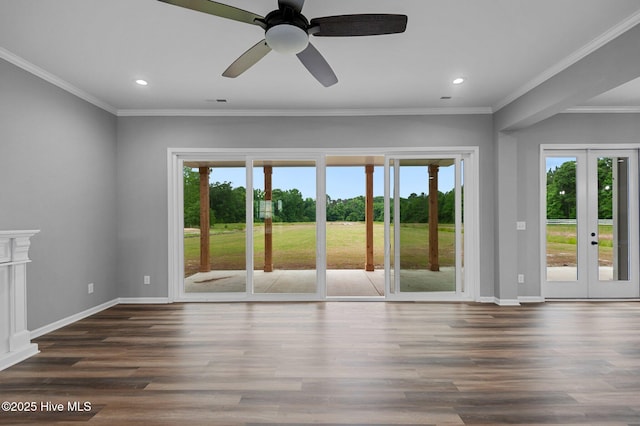 empty room featuring french doors, healthy amount of natural light, a ceiling fan, recessed lighting, and wood finished floors