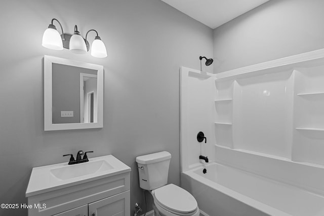 full bath featuring vanity, toilet, and shower / washtub combination