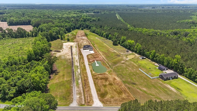 aerial view of property's location with a heavily wooded area