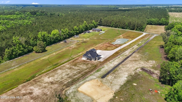 overview of rural landscape featuring a heavily wooded area