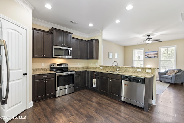 202 Bungalow Rd, Holly Ridge, NC 28445 - kitchen featuring stainless steel appliances, a sink, a peninsula, a ceiling fan, and dark wood-style flooring