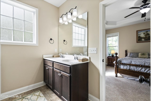 202 Bungalow Rd, Holly Ridge, NC 28445 - bathroom with a ceiling fan, baseboards, double vanity, ensuite bathroom, and ornamental molding