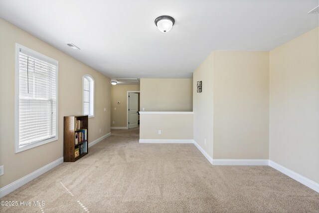 202 Bungalow Rd, Holly Ridge, NC 28445 - empty room with light carpet, baseboards, and attic access