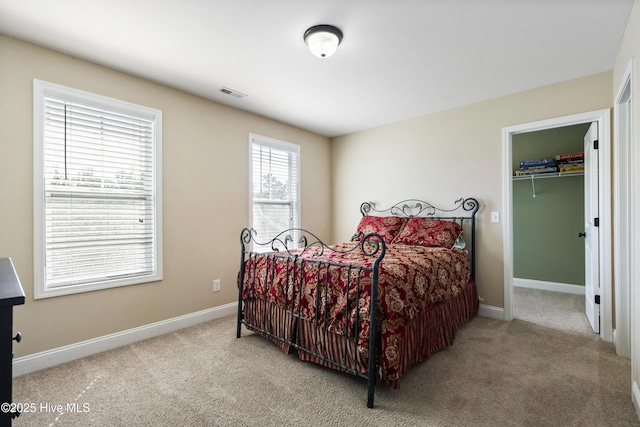 202 Bungalow Rd, Holly Ridge, NC 28445 - bedroom featuring carpet floors, baseboards, and a walk in closet