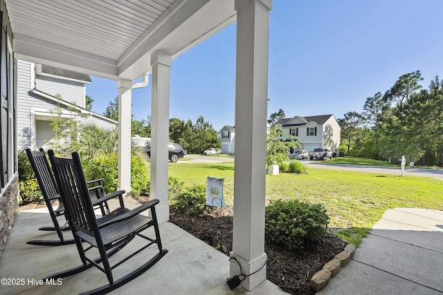 202 Bungalow Rd, Holly Ridge, NC 28445 - view of patio with a porch and a residential view