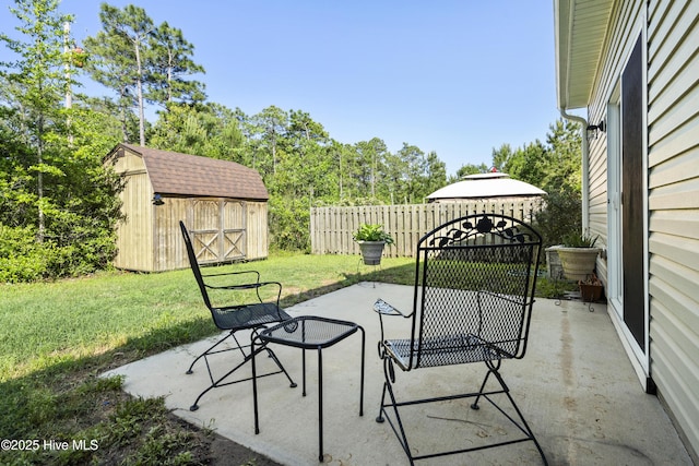 202 Bungalow Rd, Holly Ridge, NC 28445 - view of patio / terrace with a storage unit and an outdoor structure