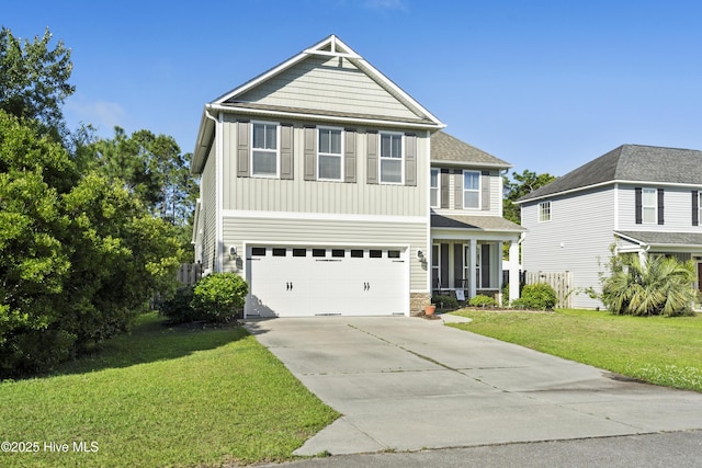 202 Bungalow Rd, Holly Ridge, NC 28445 - view of front of property with concrete driveway, a front yard, a garage, board and batten siding, and stone siding