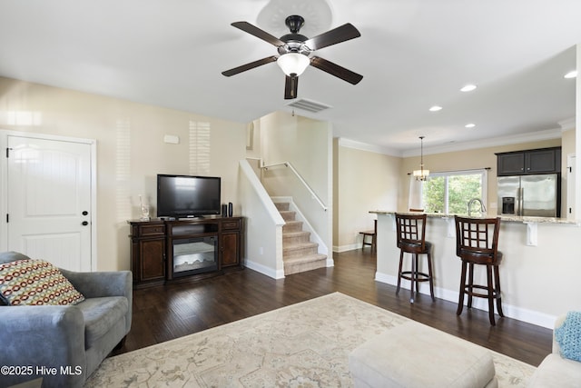 202 Bungalow Rd, Holly Ridge, NC 28445 - living room with stairs, a ceiling fan, dark wood-style floors, ornamental molding, and recessed lighting