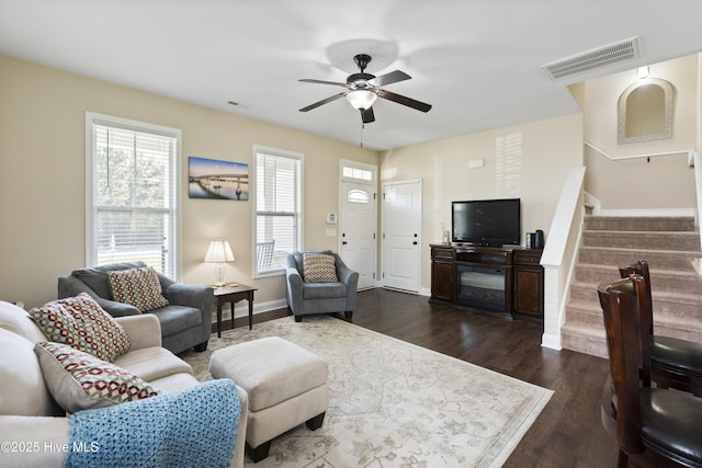 202 Bungalow Rd, Holly Ridge, NC 28445 - living room featuring stairway, dark wood-style flooring, a ceiling fan, and baseboards