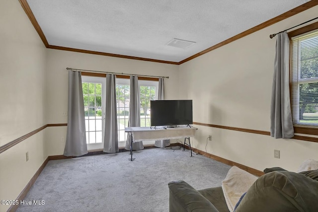 805 Hamlet Ave, Carolina Beach, NC 28428 - living room featuring crown molding, carpet floors, a textured ceiling, and baseboards