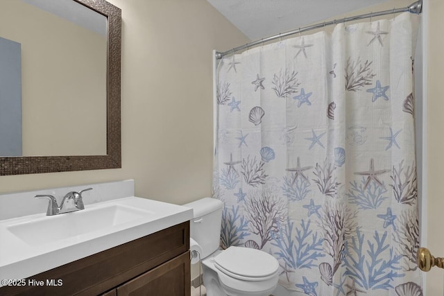 805 Hamlet Ave, Carolina Beach, NC 28428 - bathroom with toilet, vanity, and curtained shower