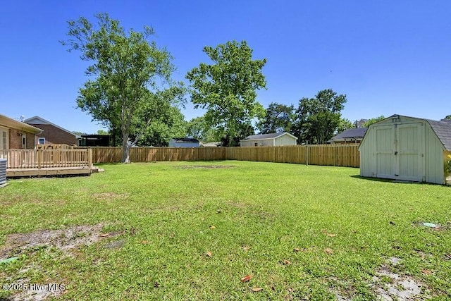 805 Hamlet Ave, Carolina Beach, NC 28428 - view of yard with a storage unit, an outbuilding, and a deck