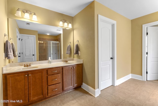 5613 Swiss Stone Ct, Wilmington, NC 28412 - full bathroom with a stall shower, baseboards, tile patterned flooring, and double vanity