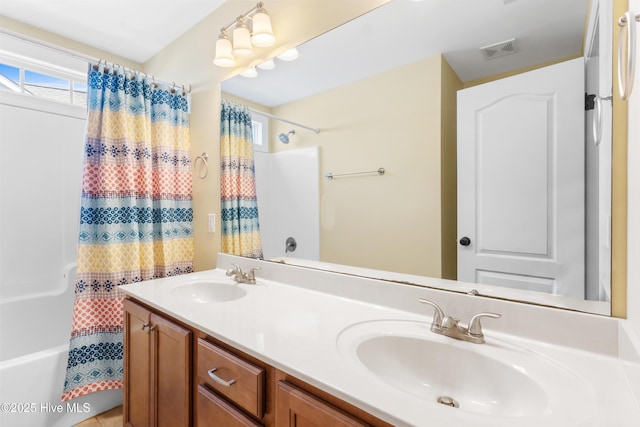 5613 Swiss Stone Ct, Wilmington, NC 28412 - full bathroom with double vanity and shower / bath combination with curtain
