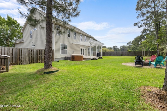 5613 Swiss Stone Ct, Wilmington, NC 28412 - view of yard with an outdoor fire pit, a hot tub, a pergola, and a patio area