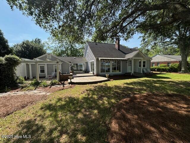 314 Madam Moores Ln, New Bern, NC 28562 - rear view of house featuring a chimney, a patio area, and a yard