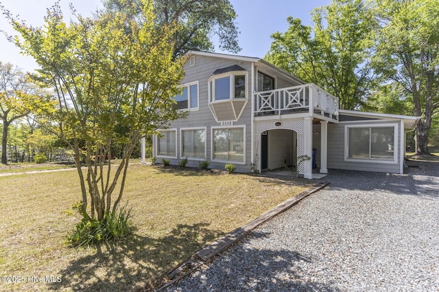 2038 Trinity Ave, Wilmington, NC 28411 - view of front of home featuring a front lawn and a wooden deck
