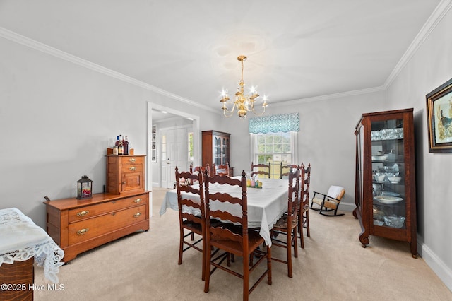 120 Oakes Rd, Hookerton, NC 28538 - dining space with light colored carpet, a chandelier, ornamental molding, and baseboards