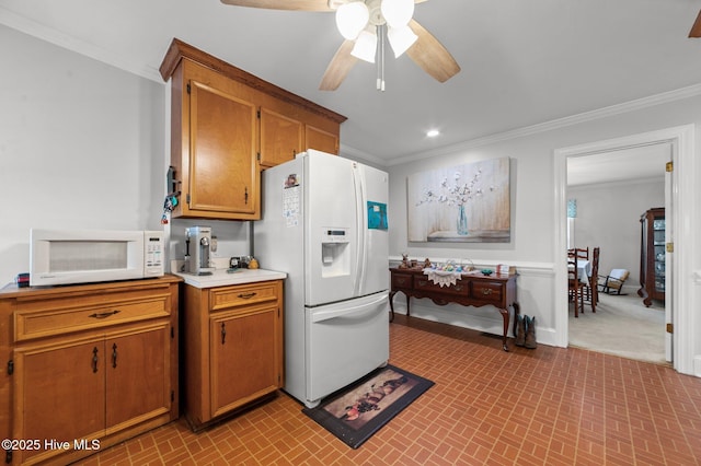120 Oakes Rd, Hookerton, NC 28538 - kitchen featuring white appliances, crown molding, ceiling fan, brick patterned floors, and brown cabinetry