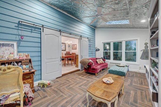3508 Whispering Pines Ct, Wilmington, NC 28409 - living area featuring a barn door, an ornate ceiling, wooden walls, and ceiling fan