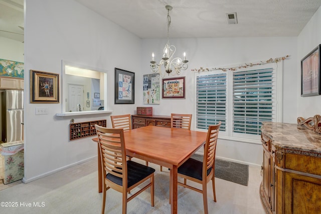 3508 Whispering Pines Ct, Wilmington, NC 28409 - dining area featuring light carpet, a chandelier, lofted ceiling, and baseboards