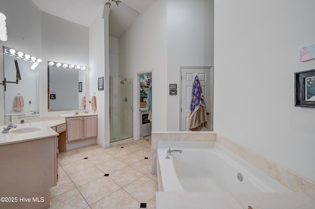 3508 Whispering Pines Ct, Wilmington, NC 28409 - full bath featuring a shower stall, a high ceiling, a bath, vanity, and tile patterned flooring