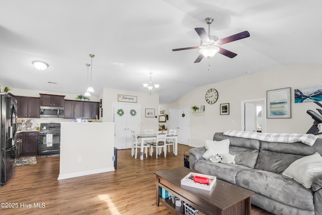 115 Joan Ct, New Bern, NC 28562 - living area with lofted ceiling, a ceiling fan, dark wood-type flooring, and a chandelier