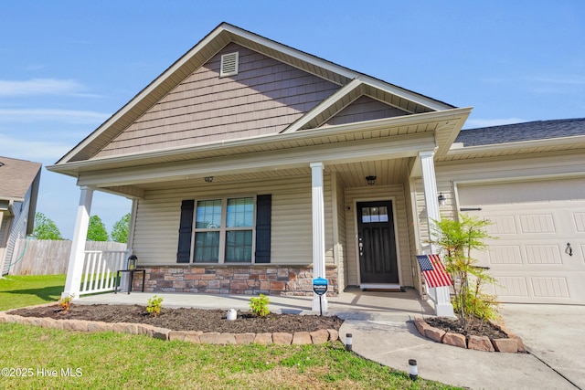 115 Joan Ct, New Bern, NC 28562 - view of front of home featuring covered porch, a garage, stone siding, and driveway