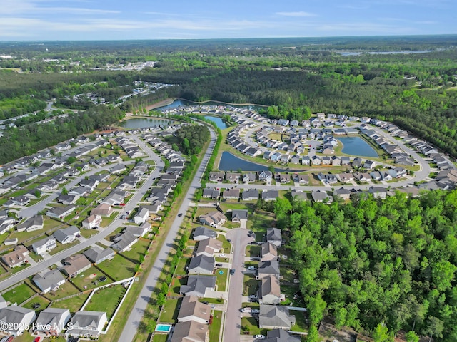115 Joan Ct, New Bern, NC 28562 - aerial view of property and surrounding area featuring a forest, a large body of water, and nearby suburban area