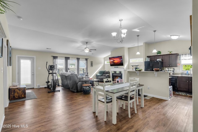 115 Joan Ct, New Bern, NC 28562 - dining area with vaulted ceiling, wood finished floors, a chandelier, and a ceiling fan