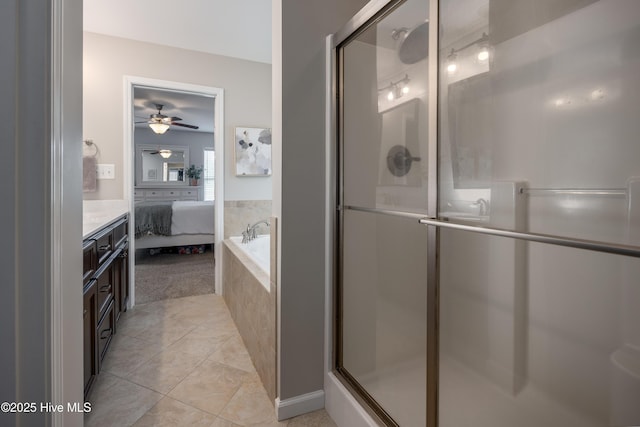 104 Northgate Ln, Clinton, NC 28328 - ensuite bathroom featuring a stall shower, a ceiling fan, and tile patterned flooring